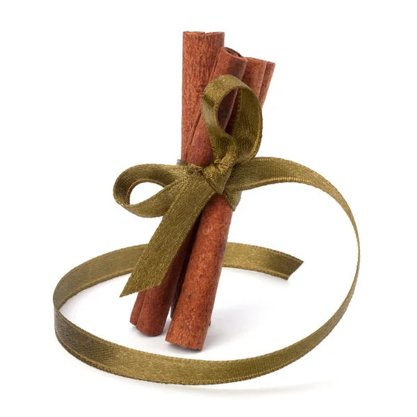 Festive wrapped cinnamon sticks — Stock Photo, Image