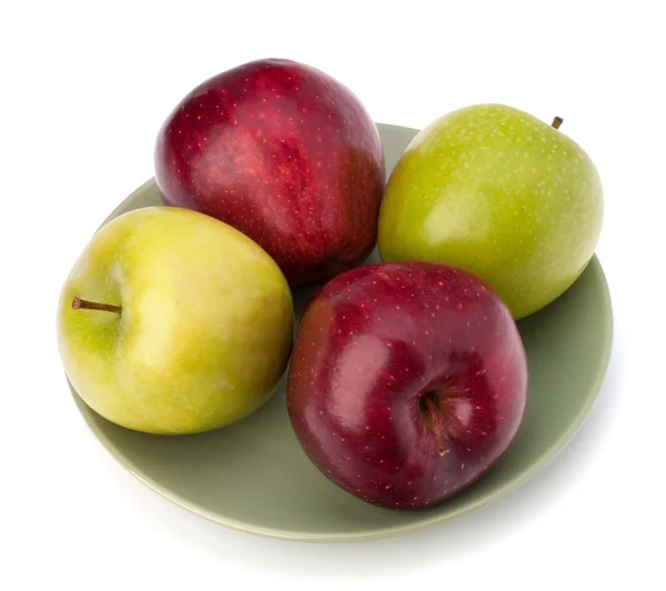 Pila de manzanas en el plato — Foto de Stock