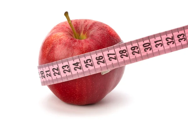 Μήλο με τη μεζούρα. έννοια του υγιεινού τρόπου ζωής. — Φωτογραφία Αρχείου