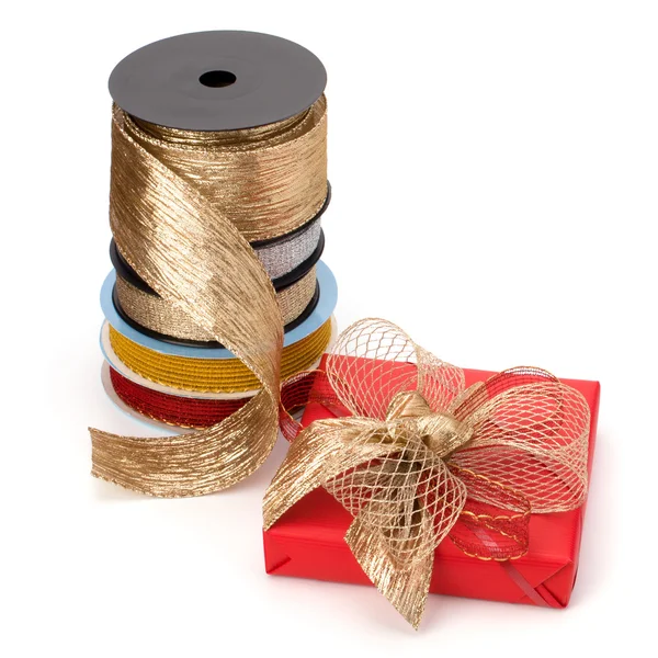 Festive gift box and wrapping ribbons isolated on white backgrou — Stock Photo, Image