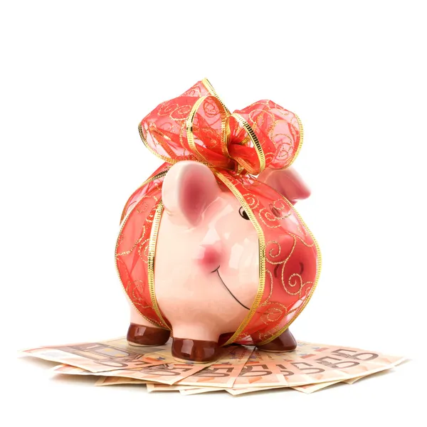 Christmas deposit concept. Piggy bank with festive bow isolated — Stock Photo, Image
