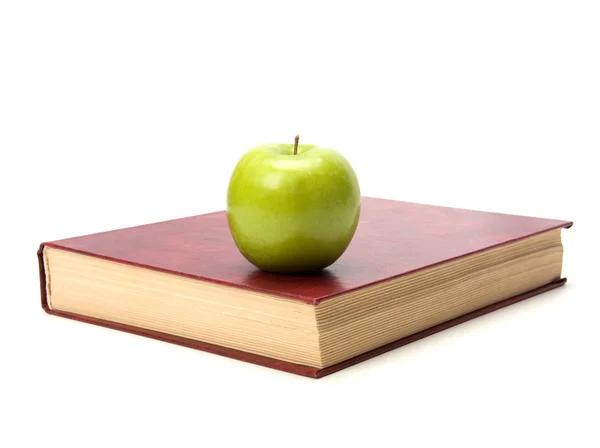 Boek met appel geïsoleerd op witte achtergrond — Stockfoto