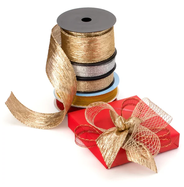 Festive gift box and wrapping ribbons isolated on white backgrou — Stock Photo, Image