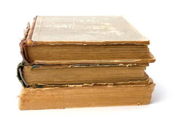 Pila de libros andrajosos aislados sobre fondo blanco — Foto de Stock