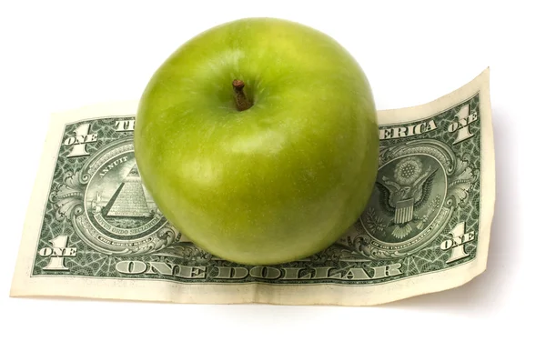 Яблоко и деньги изолированы. Концепция здоровья — стоковое фото