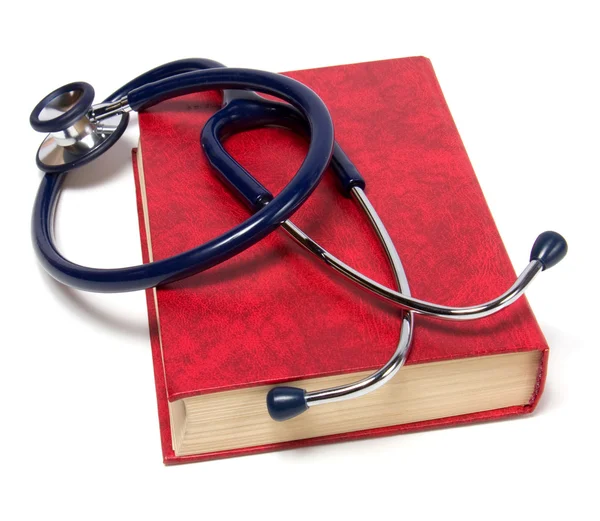 Stetoskop na červené knize izolovaných na bílém pozadí — Stock fotografie