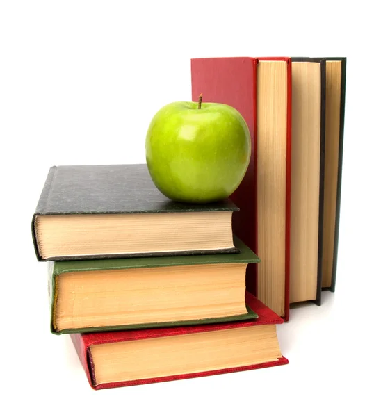 Pilha de livro com maçã isolada no fundo branco — Fotografia de Stock