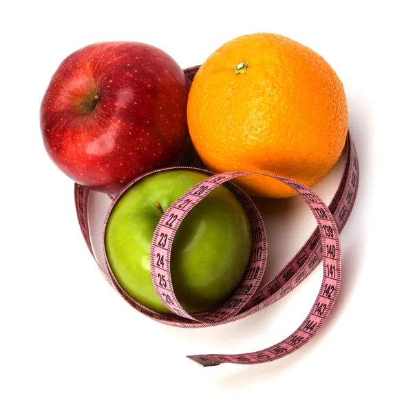 Tape measure wrapped around fruits isolated on white background — Stock Photo, Image