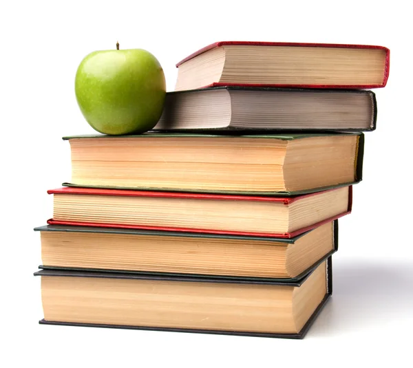 Pilha de livro com maçã isolada no fundo branco — Fotografia de Stock