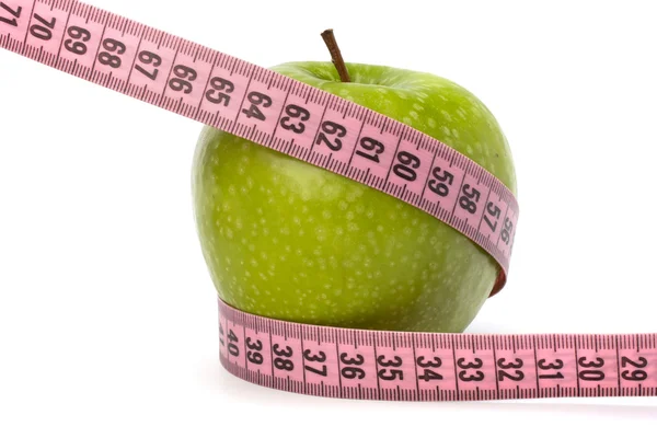 Apple with tape measure. Healthy lifestyle concept. Stock Picture