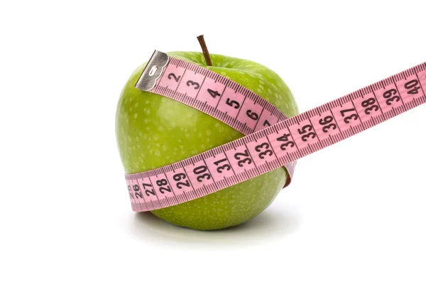Manzana con cinta métrica. concepto de estilo de vida saludable . Fotos De Stock