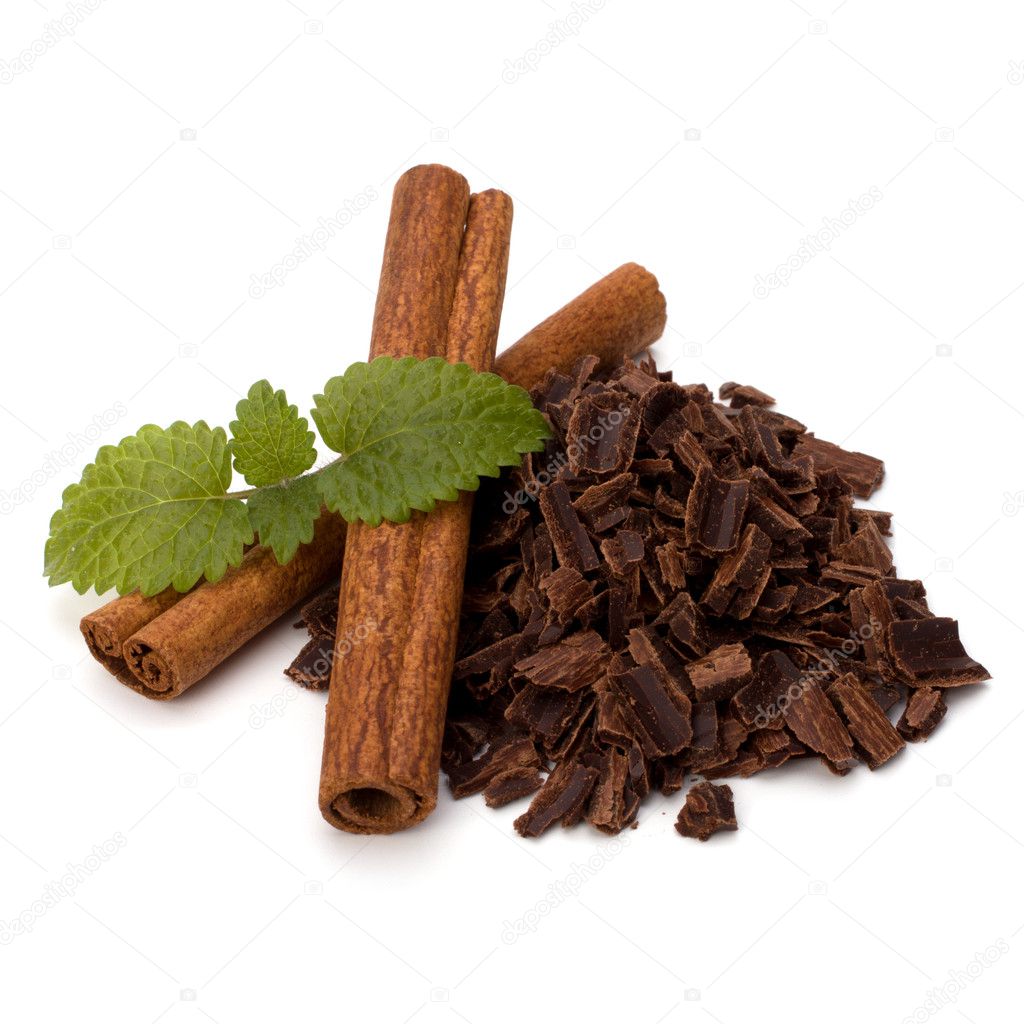 Crushed chocolate shavings pile and cinnamon sticks