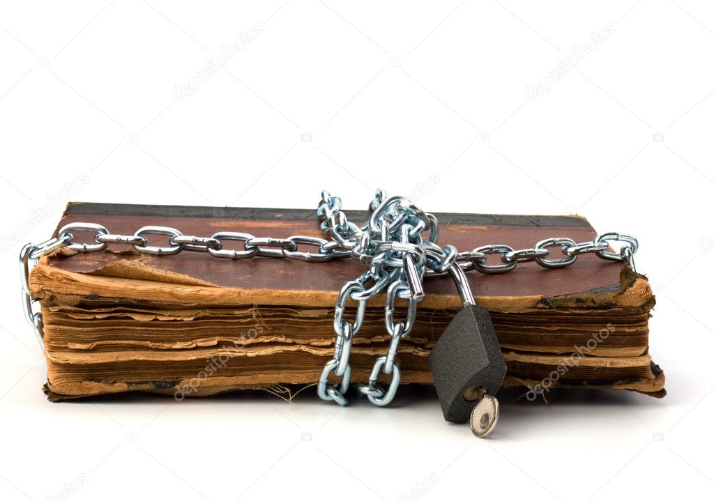 Tattered book with chain and padlock isolated on white backgroun