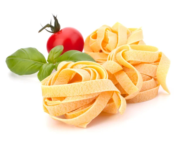 Stock image Italian pasta fettuccine nest and cherry tomato