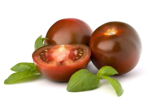 Pomodoro kumato e foglia di basilico — Foto Stock