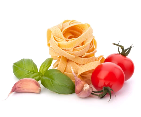 stock image Italian pasta fettuccine nest and cherry tomato