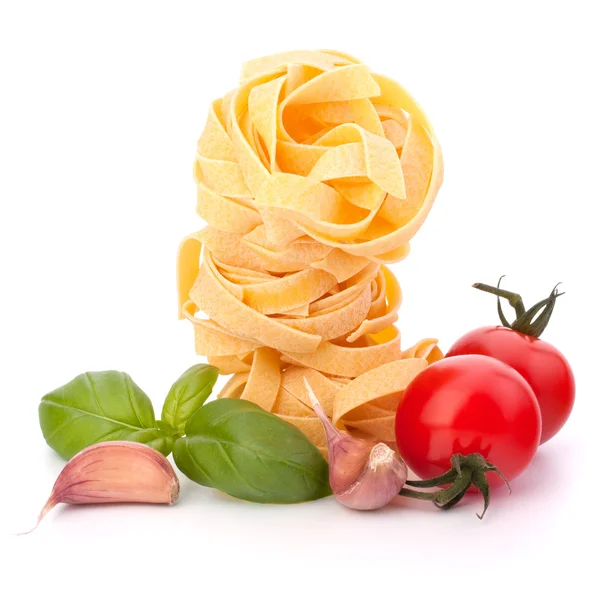 stock image Italian pasta fettuccine nest and cherry tomato