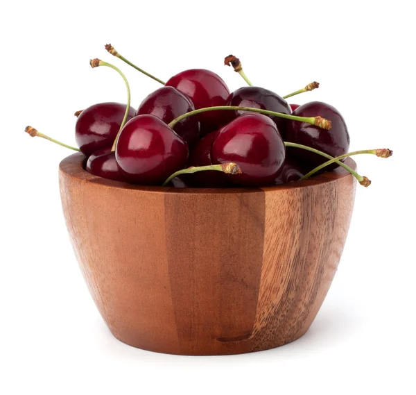 Körsbär i trä skål — Stockfoto