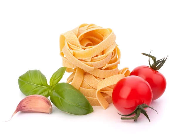 stock image Italian pasta fettuccine nest and cherry tomato