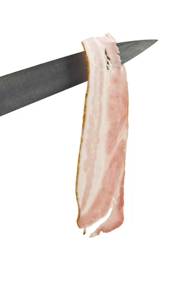 Bacon cru na faca — Fotografia de Stock