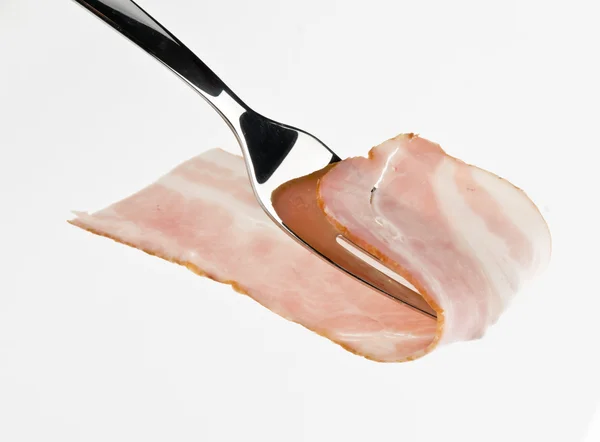 Bacon cru em garfo — Fotografia de Stock