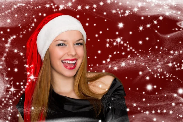Portrait of beautiful sexy woman in a santa hat on red backgroun — Stock Photo, Image