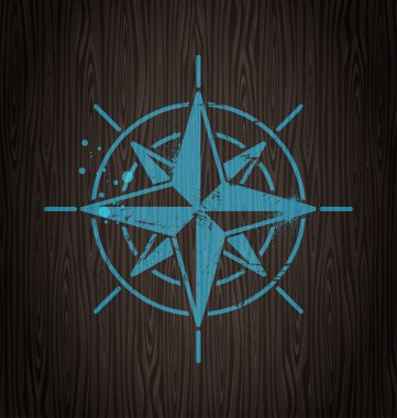 Vector compass rose painting on a wooden wall clipart