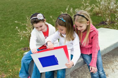 Three sisters sitting on a park clipart