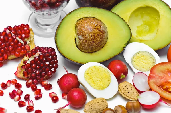 Pome Granate, avocado, egg, radish, nut, tomatoes — Stock Photo, Image