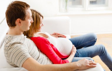 Pregnant woman with her husband clipart