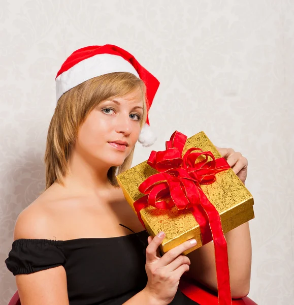Young woman with gold box — Stock Photo, Image