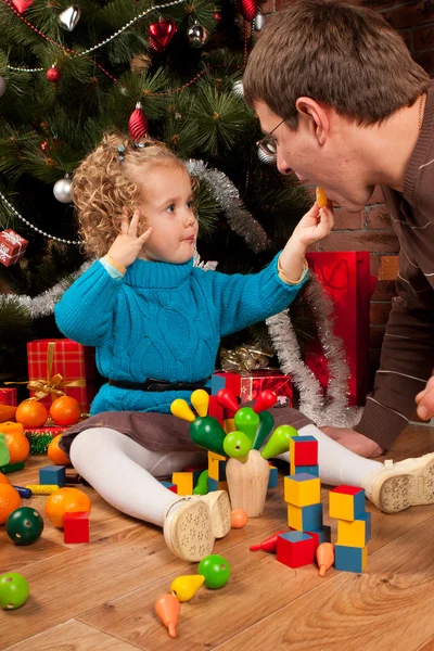 Dad and his daughter near Christmas tree — Stock Photo, Image