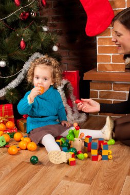 Little girl near Christmas tree clipart