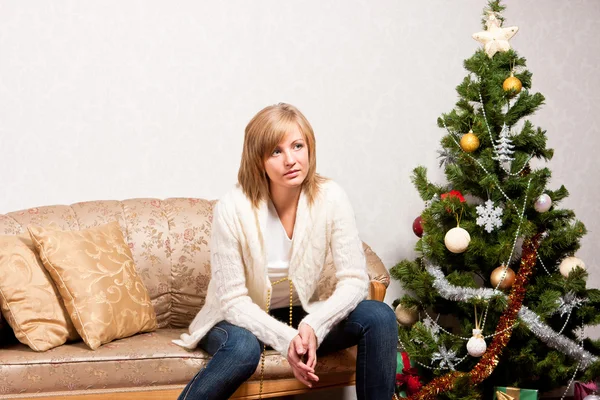 Young woman near a fir-tree — Stock Photo, Image