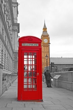 Red telephone booth in London clipart