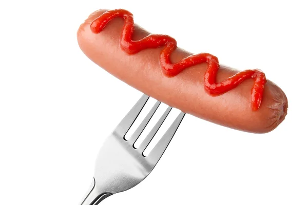Sausage on fork with ketchup topping — Stock Photo, Image
