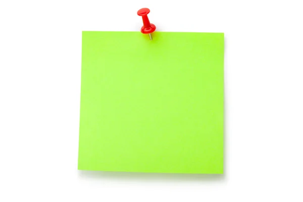 Green fluorescent sticker on red thumbtack — Stock Photo, Image
