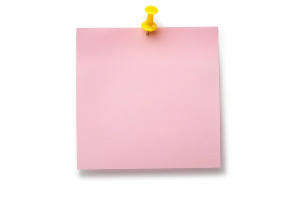 Blek rosa klistermärke på gult häftstift — Stockfoto