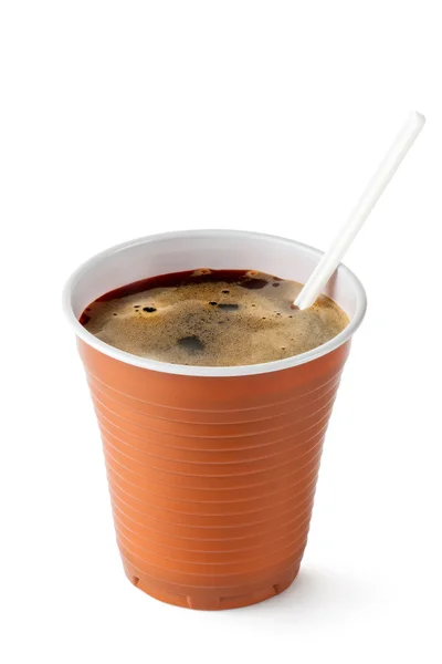 Coffee in disposable cup with plastic spoon — Stock Photo, Image