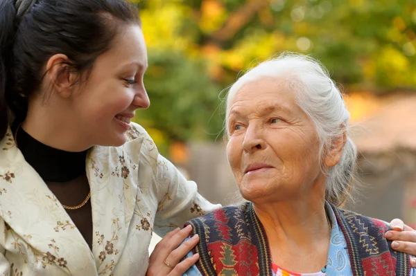 The grandmother with the grand daughter — Stock Photo, Image