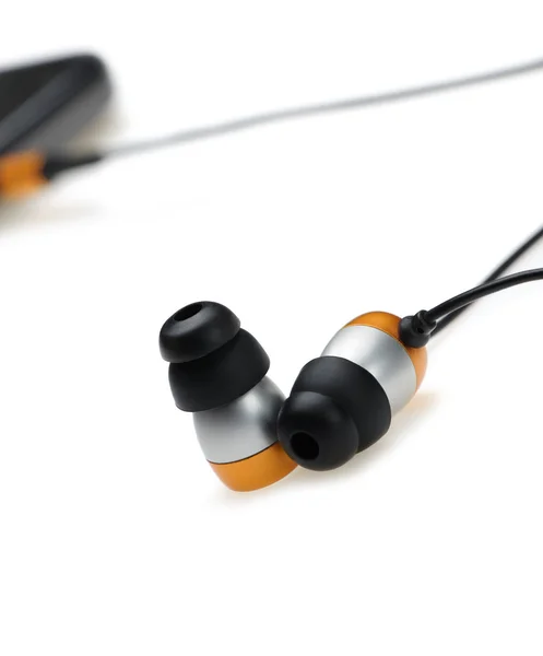 In ear headphone with mobile audio player — Stock Photo, Image