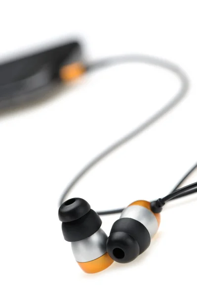 W ucho słuchawki z przenośny odtwarzacz audio — Zdjęcie stockowe