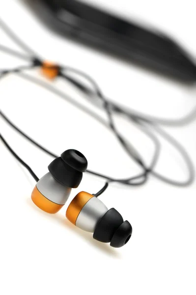 Im Ohr Kopfhörer mit mobilem Audio-Player — Stockfoto
