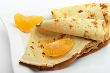 Crepe on a plate with mandarin clipart