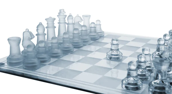 Glass chess. The first move. — Stockfoto