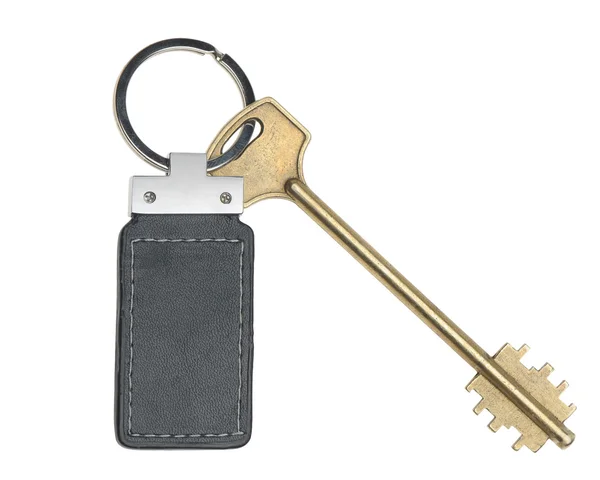 Klíč s koženými cetka — Stock fotografie