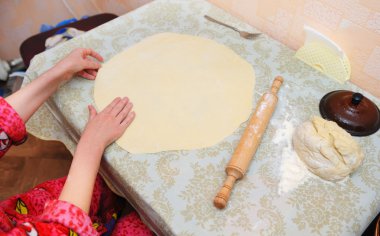 The woman prepares dough clipart