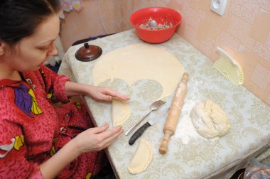 The woman prepares a pie clipart