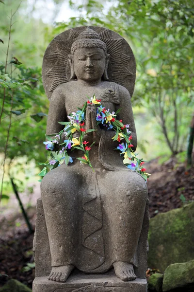 Buddha decorated with flowers — Stock Photo, Image