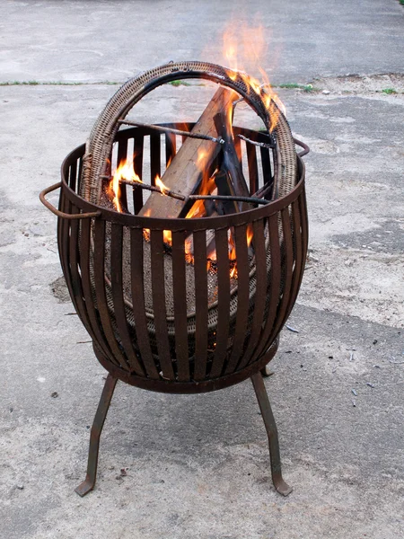 Fire in a metal fire basket — Stock Photo, Image